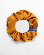 Load image into Gallery viewer, Grip Gold silk scrunchie no-snag hair tie, reversible design showing second print by Paradisefold