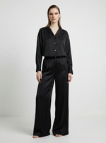 Load image into Gallery viewer, Person wearing a red silk blouse and black palazzo trousers on a white background
