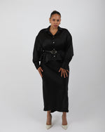 Load image into Gallery viewer, Woman wearing a black silk shirt over a black slip dress with a silver belt