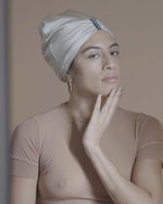 Load image into Gallery viewer, Woman wearing a pale silk turban by Paradisefold, pure mulberry silk hair wrap