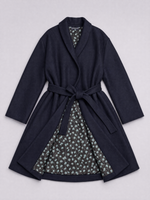 Load image into Gallery viewer, A dark navy blue wrap robe with a matching tie belt, featuring a contrasting inner lining of a dark green and white floral print, laid flat against a light gray background.
